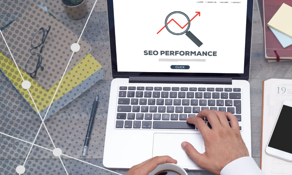 Laptop displaying SEO performance graph, person working on digital marketing, seo, social media, and public relations strategy for effective marketing.