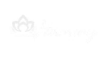 White logo with a lotus flower next to the word 