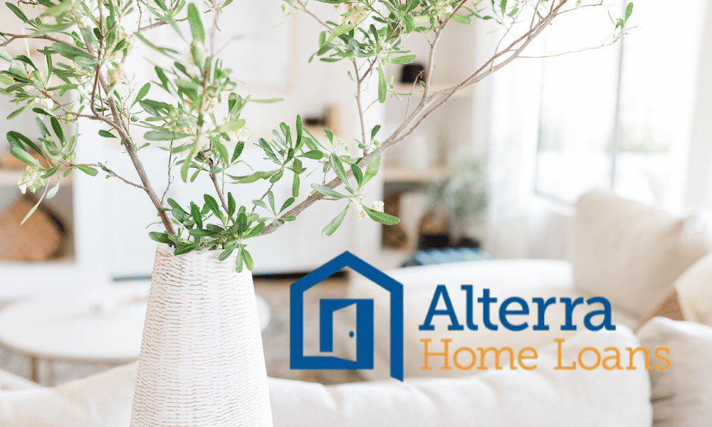 A bright living room with a white vase holding green branches, and "Alterra Home Loans" logo in blue and orange on the image. © Design Thumbprint Marketing Agency